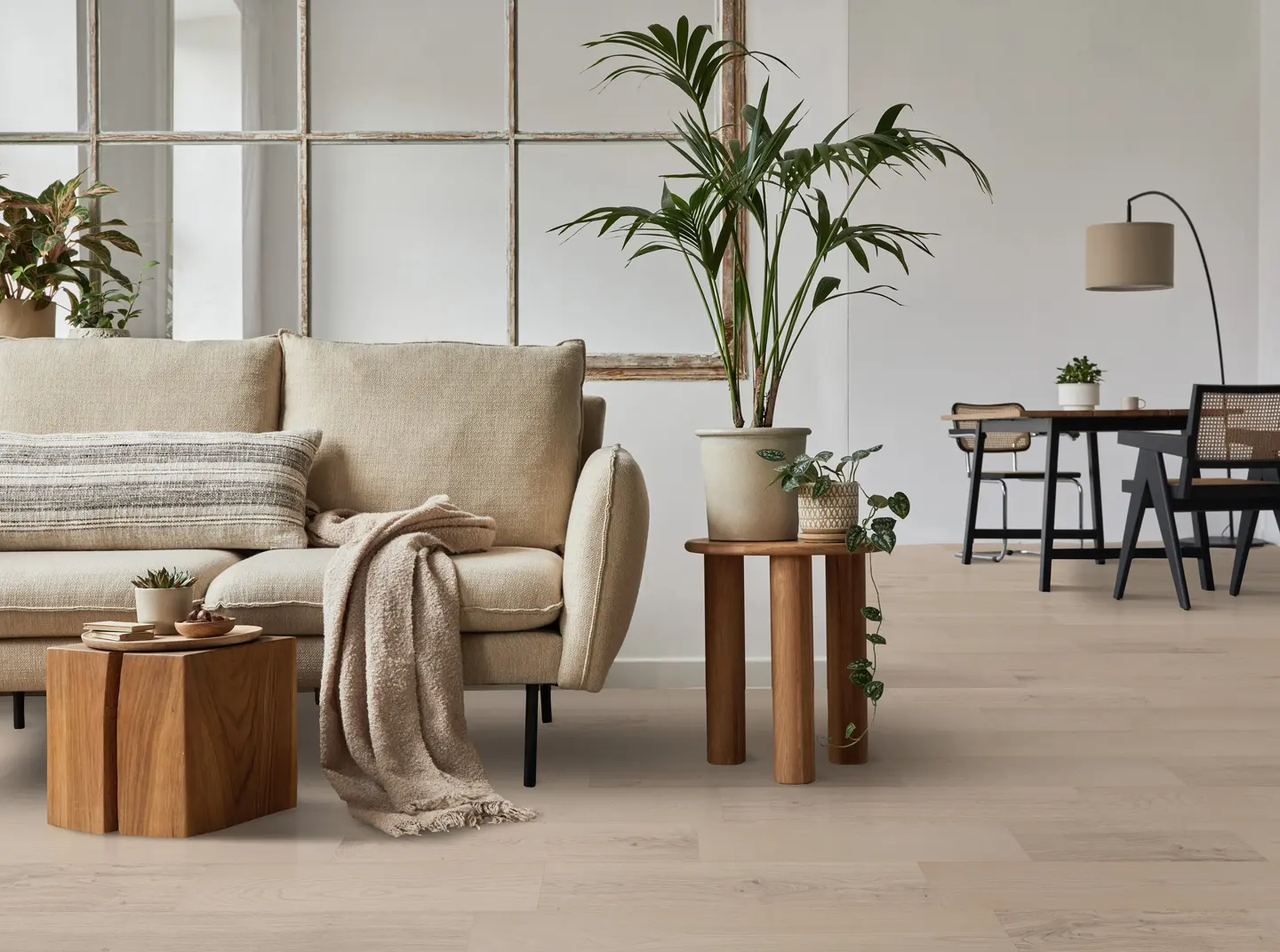 Beach Town Blanc hardwood flooring installed in a bright Orlando living room — light oak planks with a natural matte finish