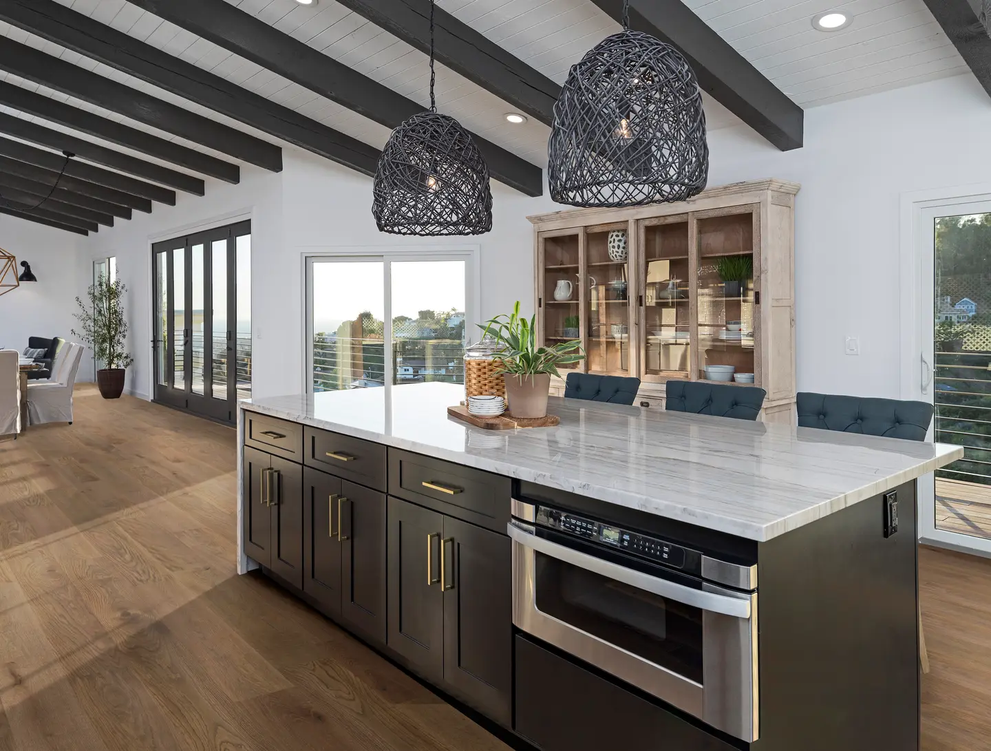 Cava Cove hardwood flooring in an Orlando living space — richly toned oak ideal for area rugs with a finish-safe pad