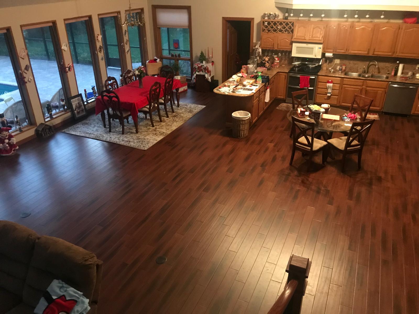 Dark espresso bamboo flooring glue-down installation in open-plan home, Central Florida