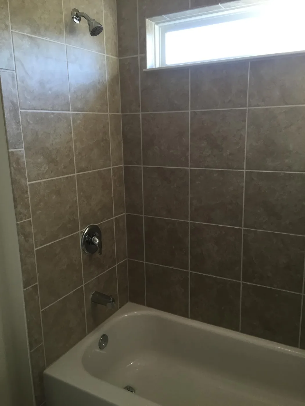 Shower tile installation in progress — showing the substrate and wall construction layers