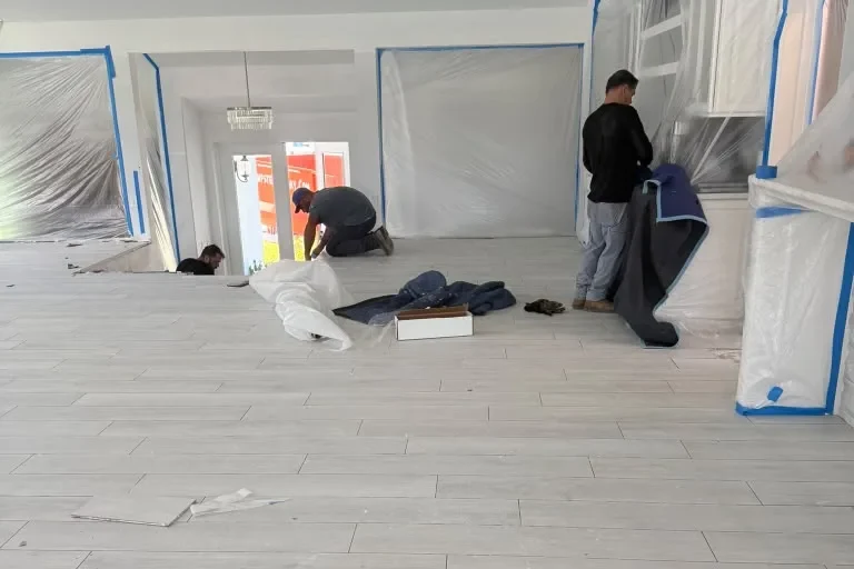 Tile demolition work area with debris removal in Orlando