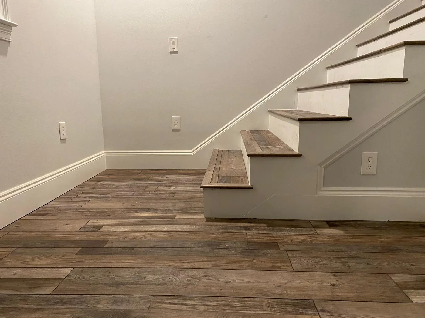 Completed stair landing with LVP flooring