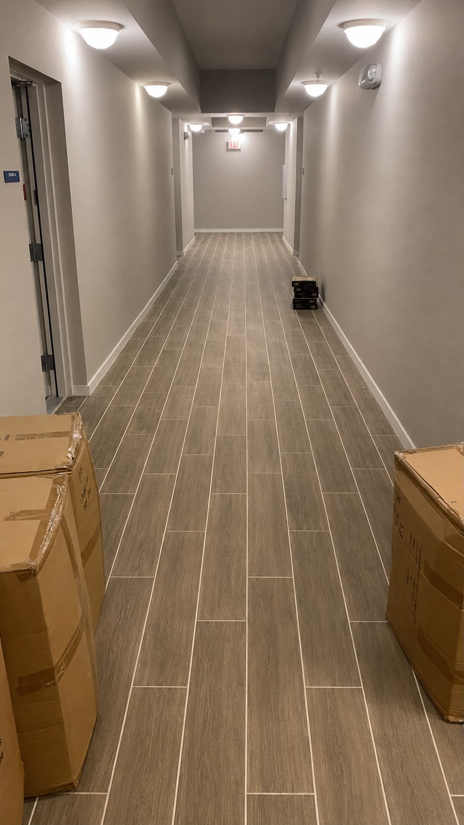 Vista Cay Resort hallway tile-look LVP installation Vista Cay Resort hallway tile-look LVP installation