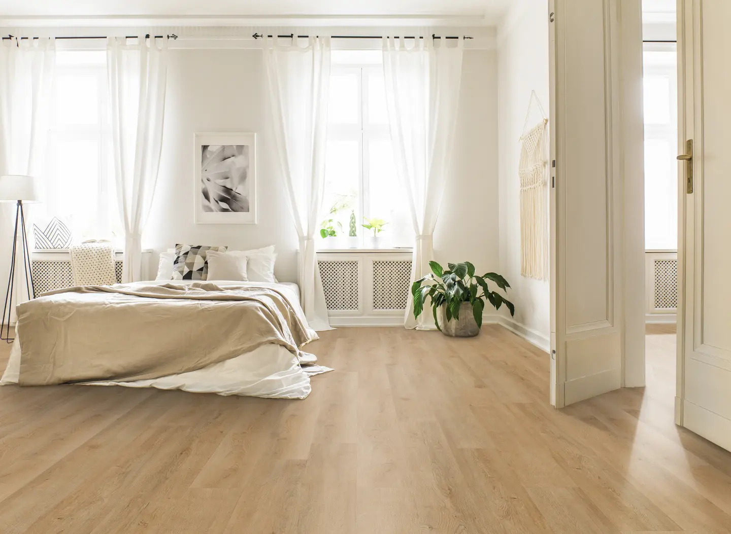 Catamaran luxury vinyl plank floating floor installed over a flat subfloor in an Orlando home — wide wood-look LVP